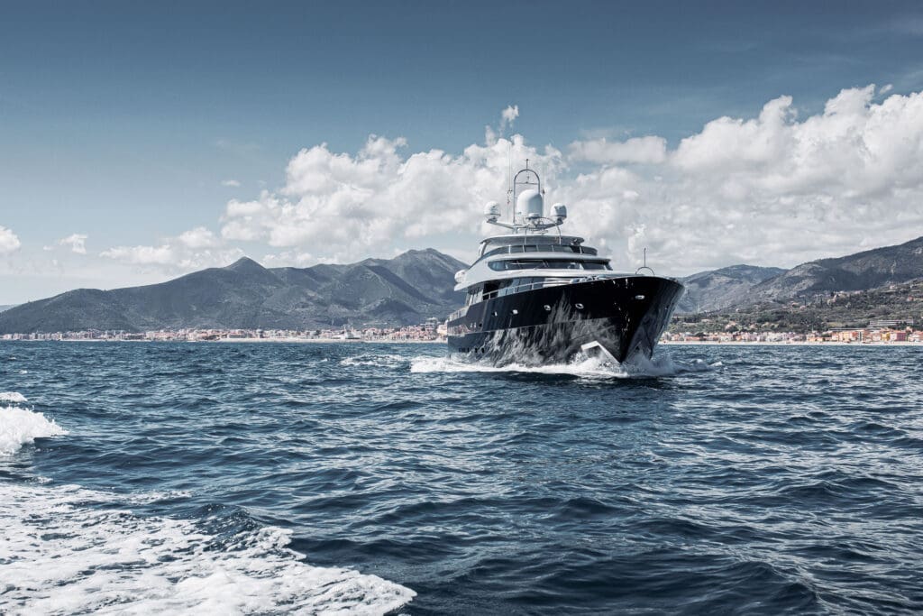 A large yacht is cruising on the sea.